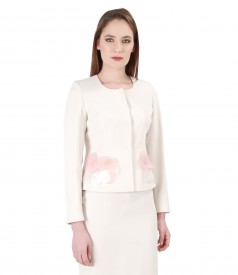 Cream jacket with accessory brooch
