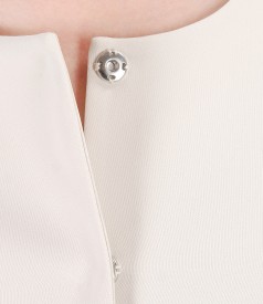 Cream jacket with accessory brooch