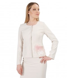 Cream jacket with accessory brooch