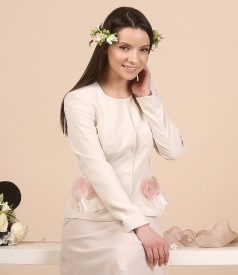 Cream jacket with accessory brooch
