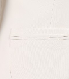 Cream jacket with accessory brooch