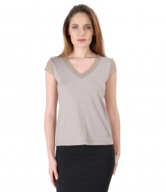 Elastic jersey blouse with trim and veil fins