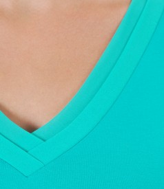 Elastic jersey blouse with trim and veil fins