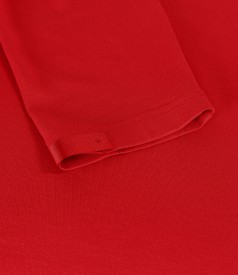 Elastic jersey blouse with rips at the decolletage and sleeve