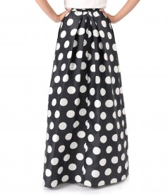 Long skirt printed with polka dots and side pockets