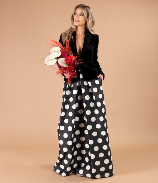 Elegant outfit with velvet jacket and long polka dot skirt