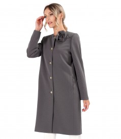 Elegant jacket made of textured fabric with a detachable brooch at the neckline