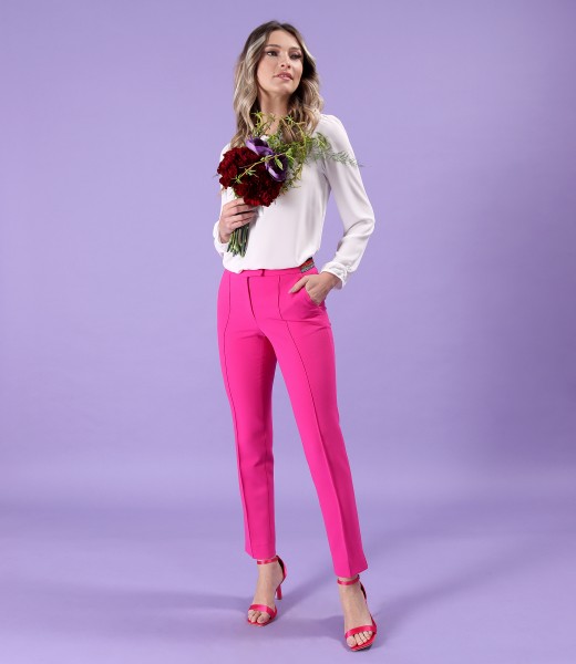 Long pants with a stripe on the front and a blouse with a scarf collar