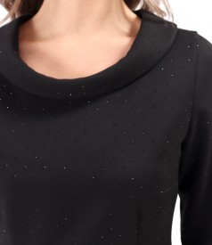 Elegant dress made of fabric with shiny applications