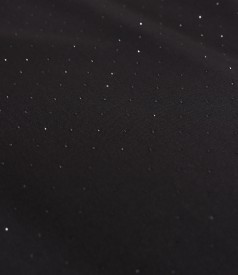 Short cocktail dress made of fabric with shiny applications
