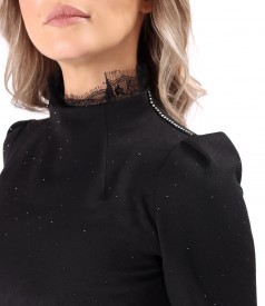Short cocktail dress made of fabric with shiny applications