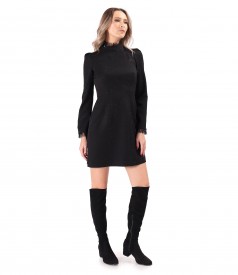 Short cocktail dress made of fabric with shiny applications