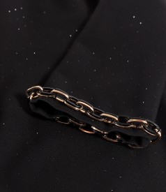 Elegant fabric dress with shiny appliqus and decorative chain