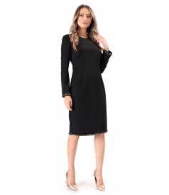 Elegant fabric dress with shiny appliqus and decorative chain