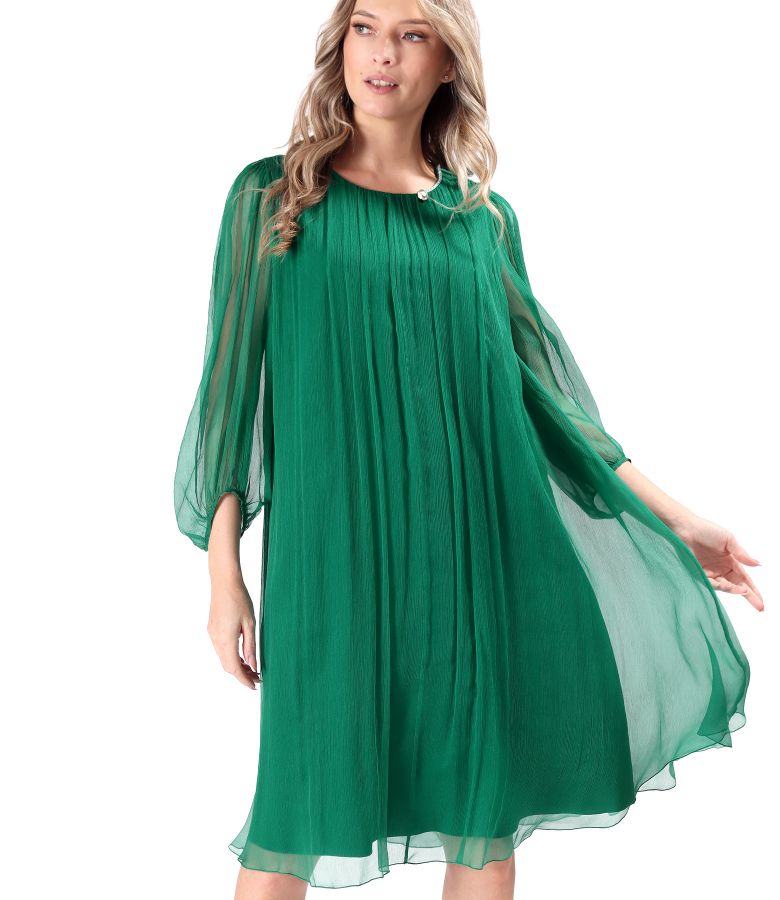 Cocktail dress made of natural silk veil with crystals at the neckline