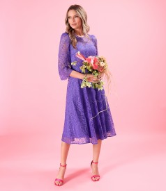 Elegant dress made of lace with floral motifs