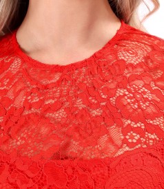 Elegant dress made of lace with floral motifs