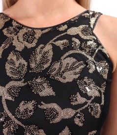 Long evening dress made of gold sequins with floral motifs